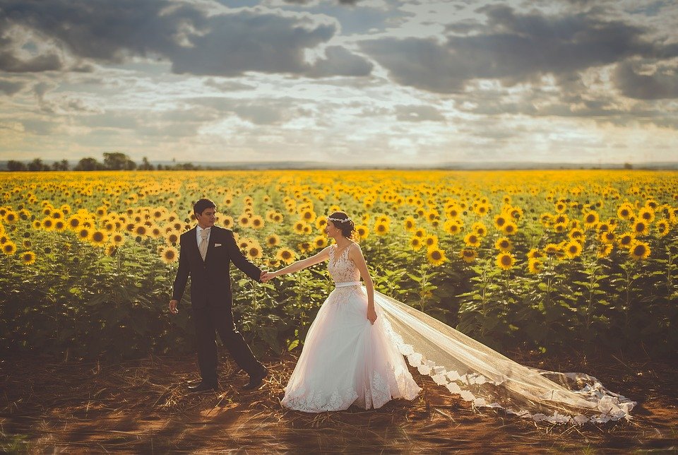 Christian couple in a field of sunflowers