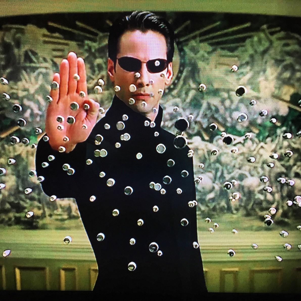 Keanu Reeves as Neo in The Matrix, a movie about simulation