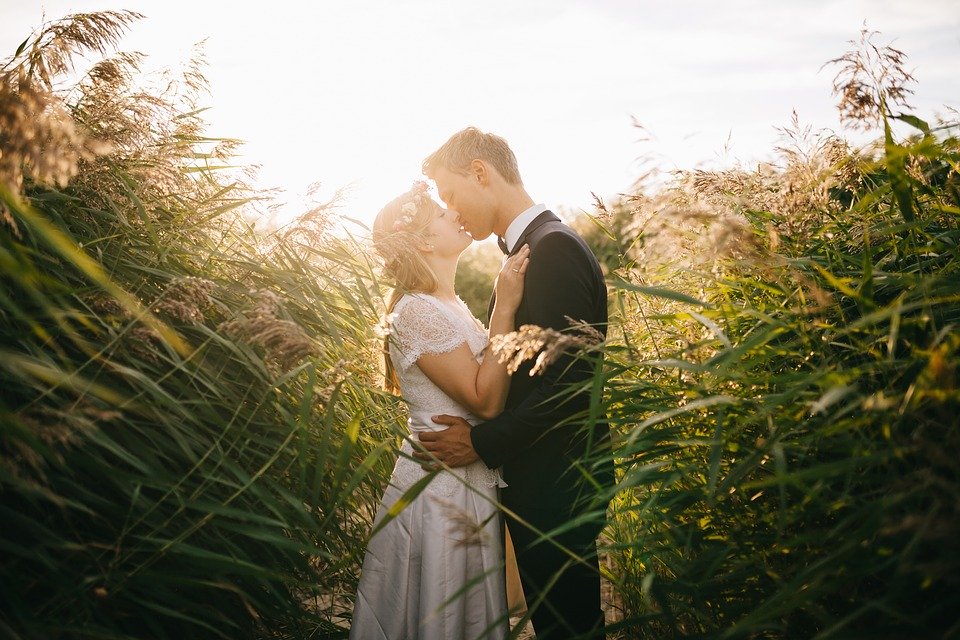 A Christian bride and groom kissing