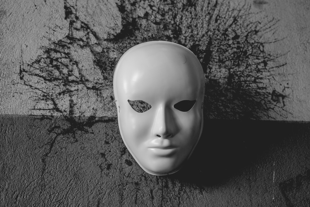 a sinister looking mask, signifying deception
