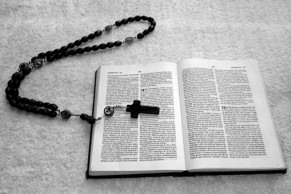 a bible and a rosary
