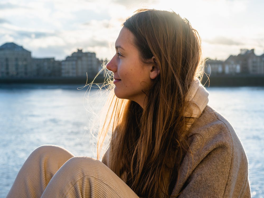 woman-sitting-seaside-divine-healing